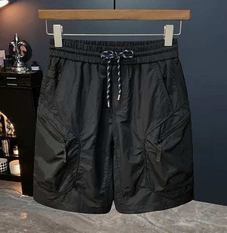 Man wearing loose-fit camouflage cargo shorts with multiple pockets, made from a cotton blend fabric.