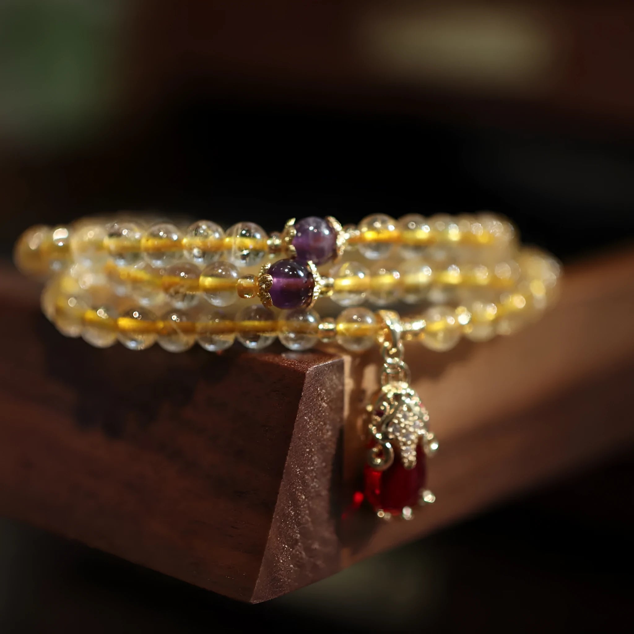 Natural Brazil gold rutilated quartz bracelet with Chinese style design featuring hanging chopsticks and three circles pattern