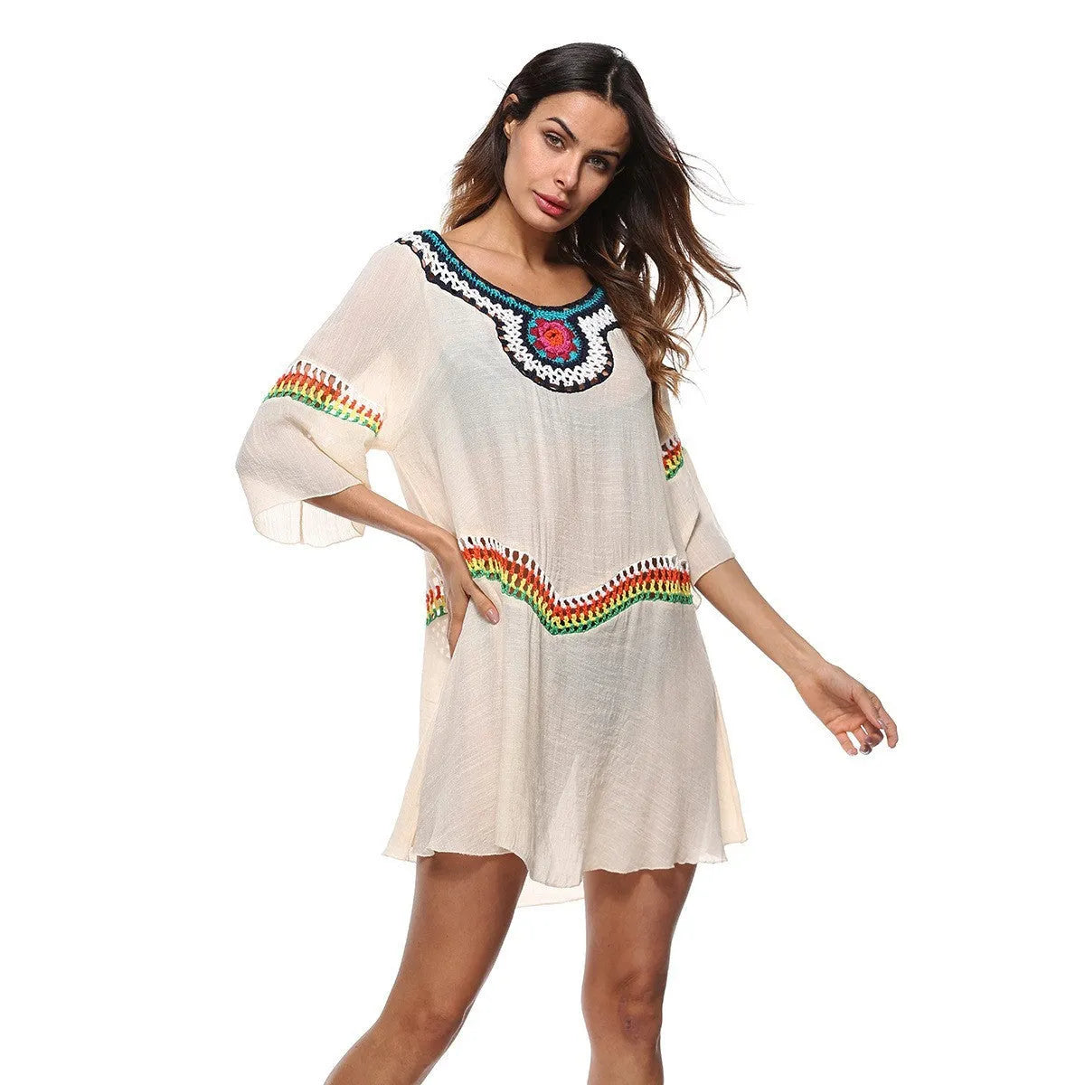 Women's crocheted white beach cover-up top for sun protection during swimming.