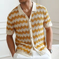 Short-sleeved yellow corrugated sweater with a hollow jacquard texture on a hanger.