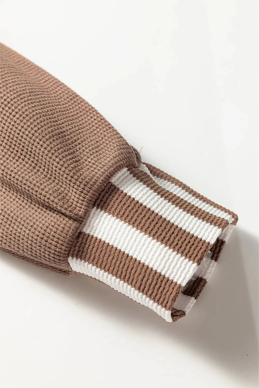 Straw yellow waffle texture hoodie with striped patchwork detail and button neck closure
