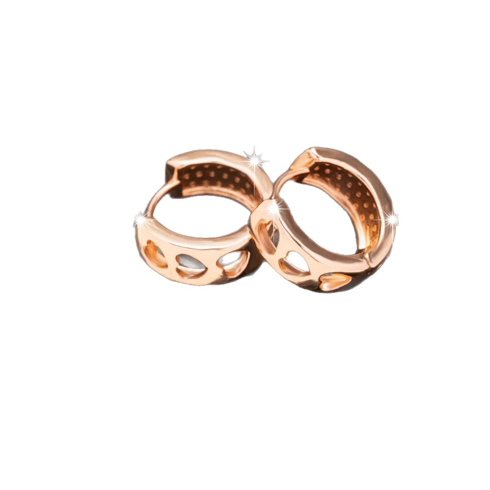 A pair of rose gold hollow heart-shaped earrings for women on a white background.