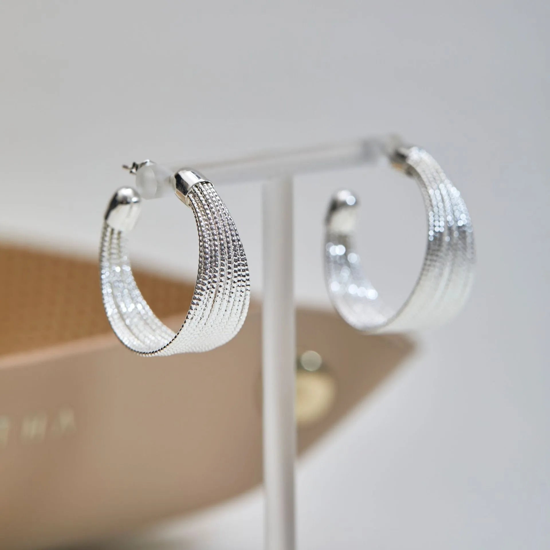 Geometric multi-layer simple bracelet earrings in gold and silver finishes with copper construction