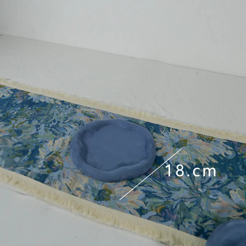 Handmade plaster jewellery display tray with necklaces and bracelets on a countertop