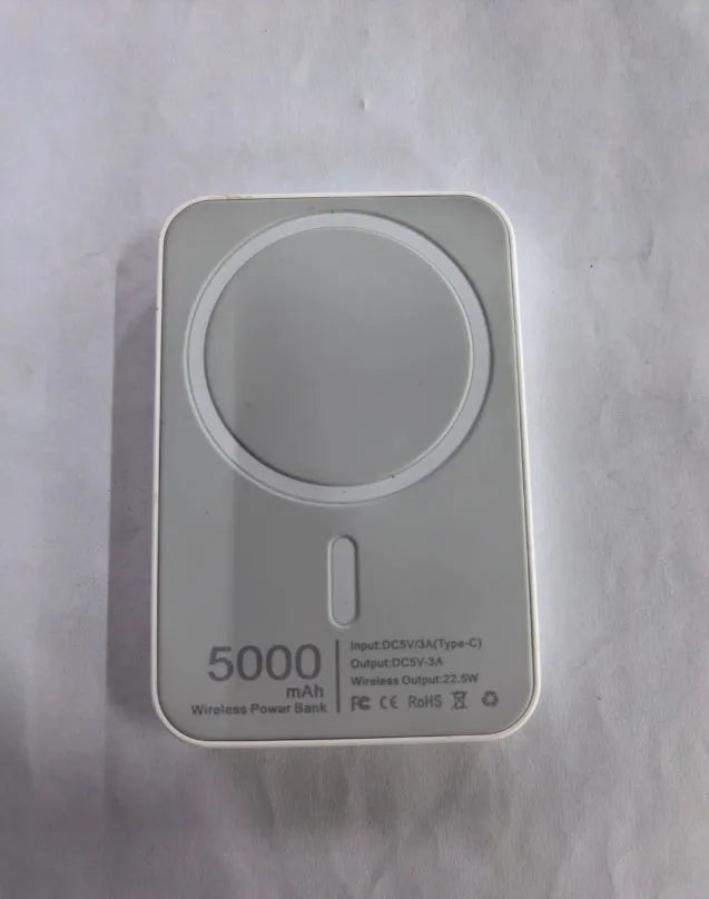 Magnetic wireless charging power bank in white with creative foot design showing charging surface