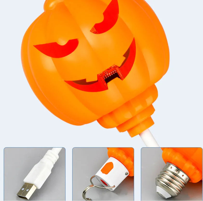 Plastic pumpkin-shaped USB lamp emitting yellow or purple light, 8.3cm wide by 22cm tall