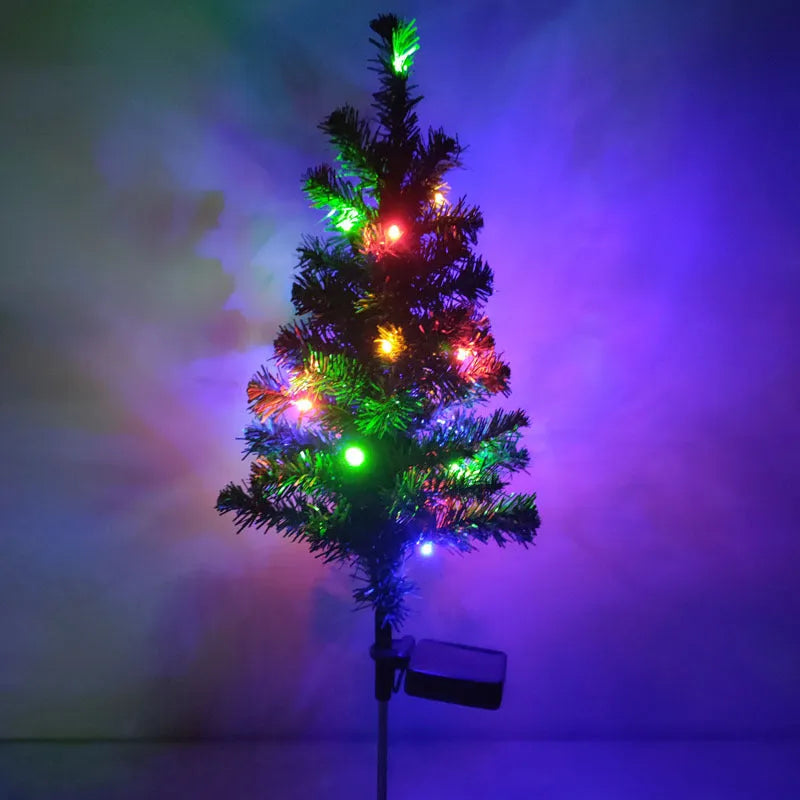 Solar Christmas tree lamp garden decoration with IP65 ABS construction placed in outdoor courtyard