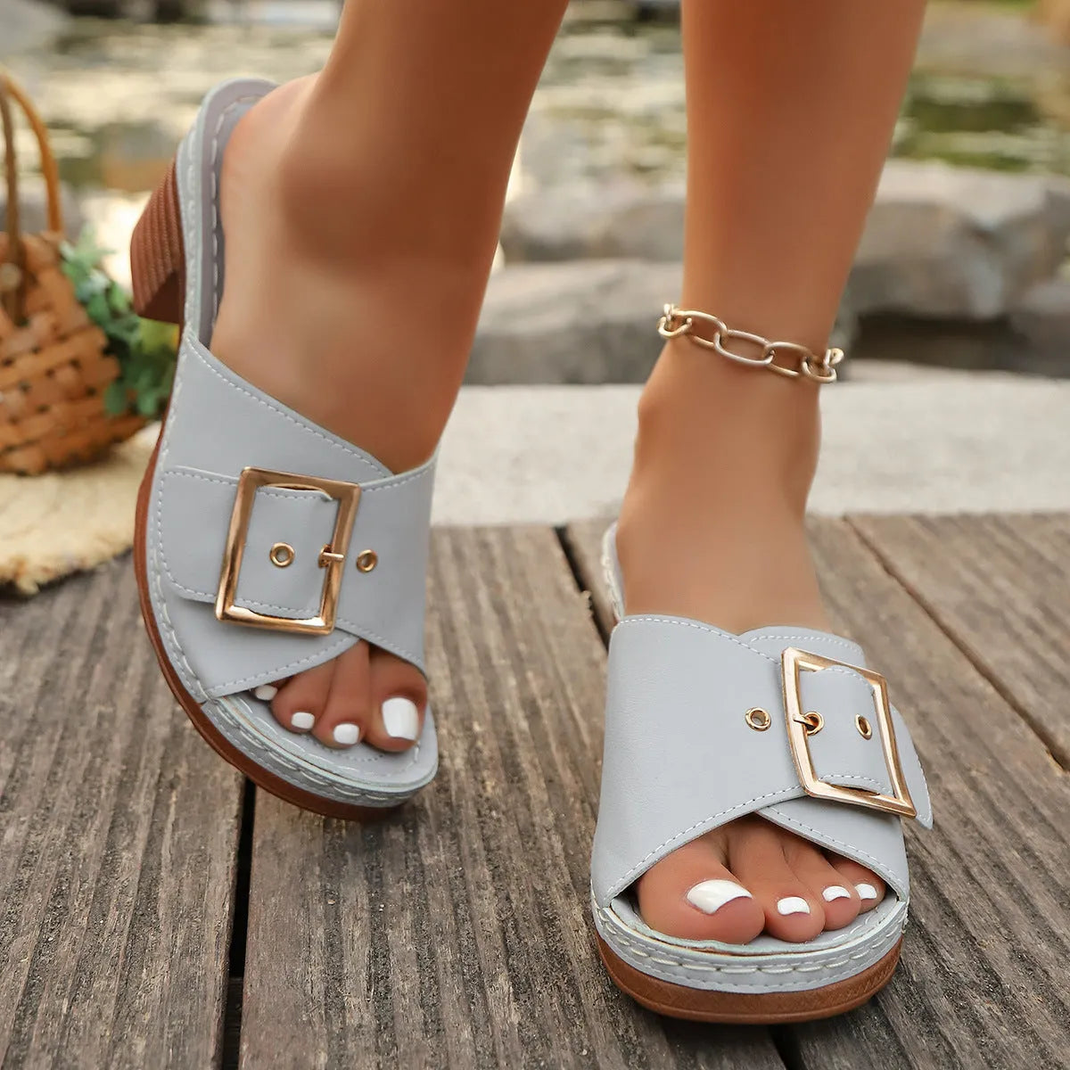 Women's black chunky heel slippers with silver metal buckle and round toe