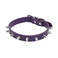 A studded black PU leather dog collar with a row of silver metal spikes and an alloy buckle.