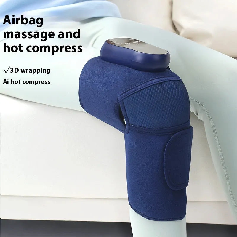 Blue self-heating knee massager unit with adjustable strap for vibration and air pressure therapy.