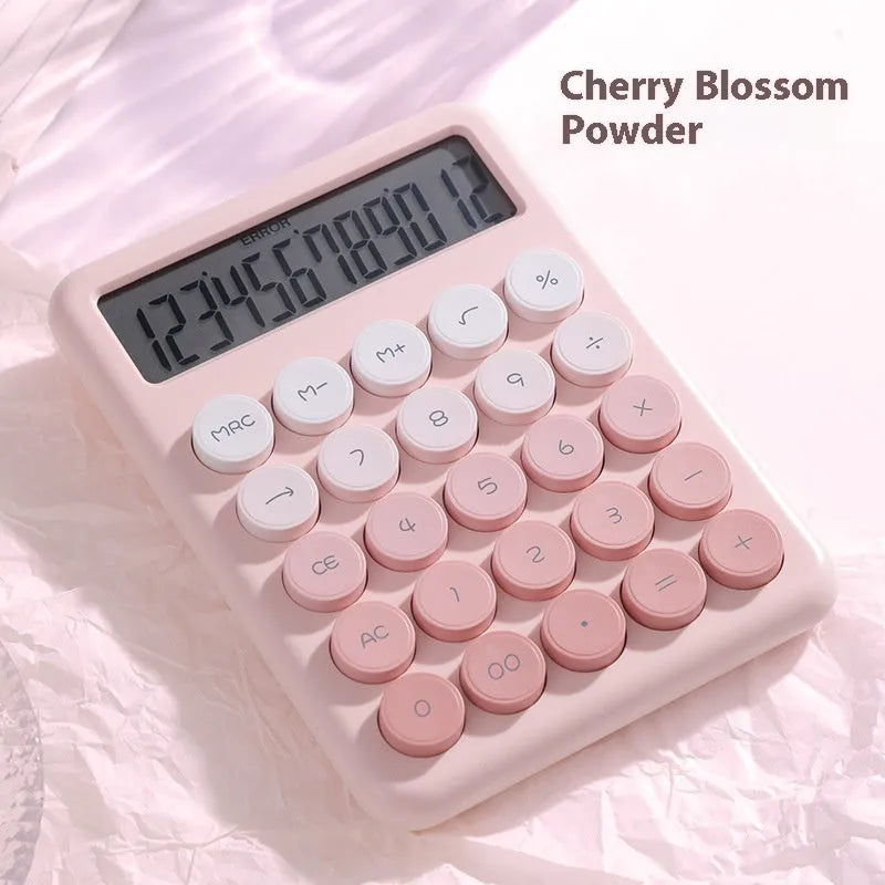 Gradient colour desk calculator showing violet, pink, blue, and green shades on an ABS plastic casing.