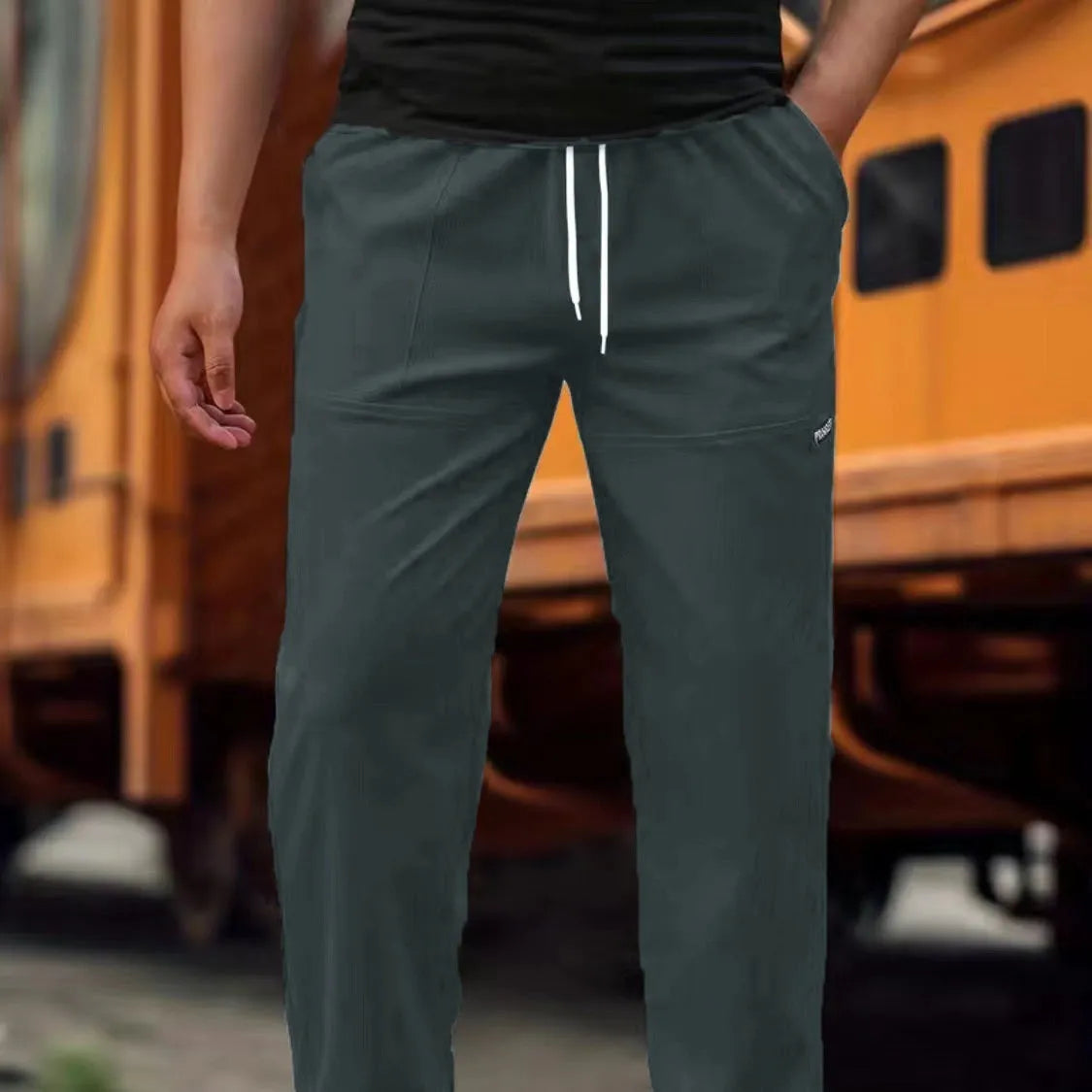 Men's casual polyester trousers for spring and autumn in various colours including light gray and black