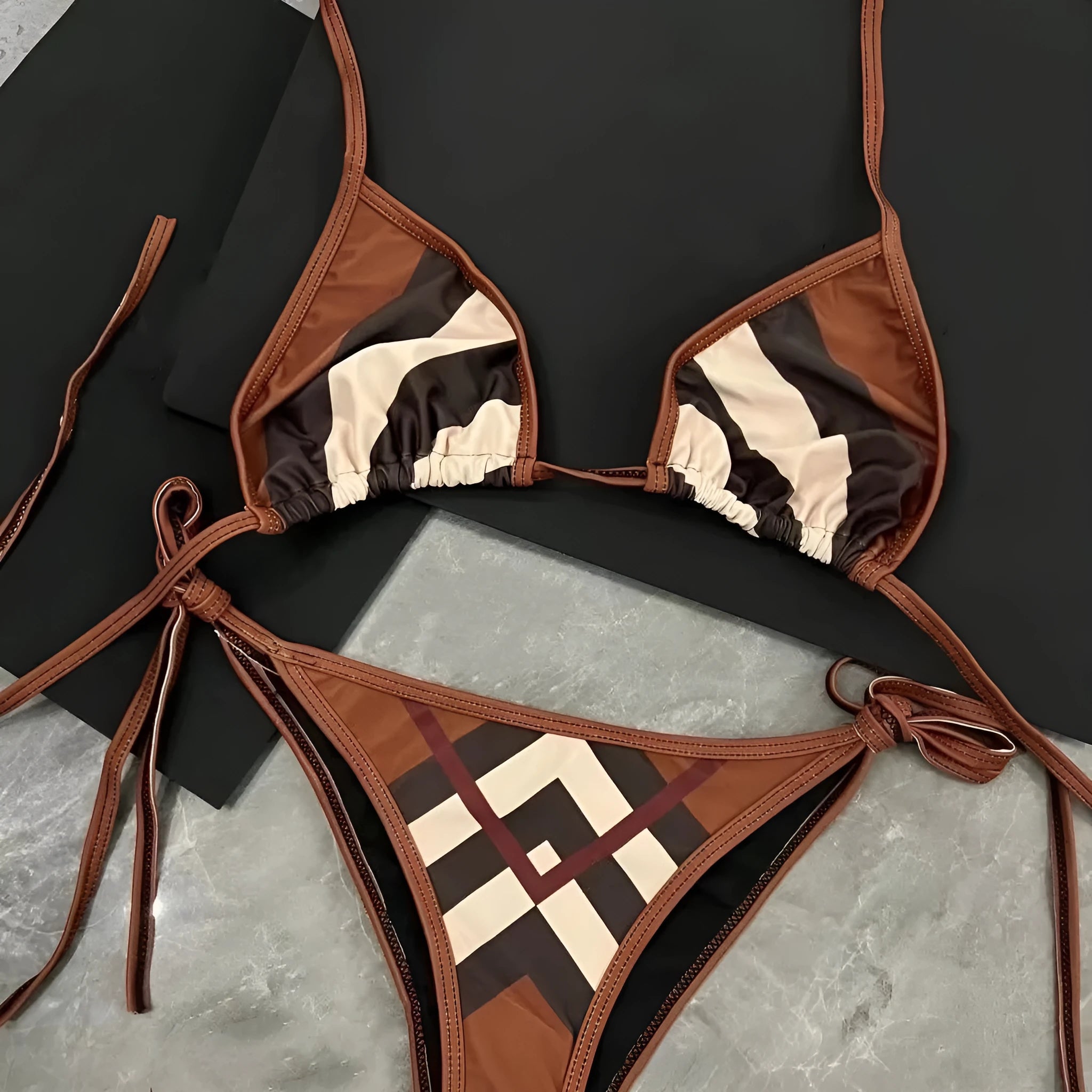 Women's black and white floral bikini set made from polyester fibre, available in sizes S M L XL