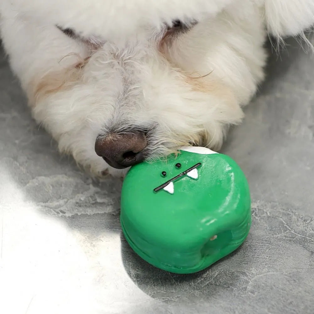 Yellow and green cartoon bread shaped latex dog squeaky chew toy on a white background.