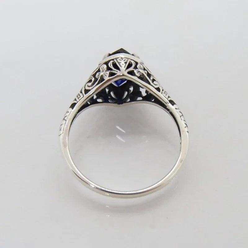 Women's geometric hollow ring in silver electroplated alloy with zircon detail showing open-work pattern
