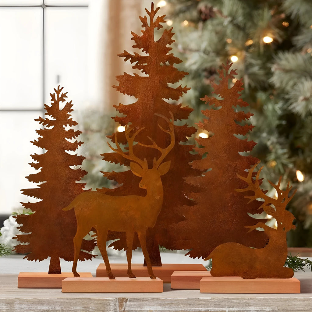 Three rusty iron Christmas decorations with elk and tree designs for rustic seasonal display