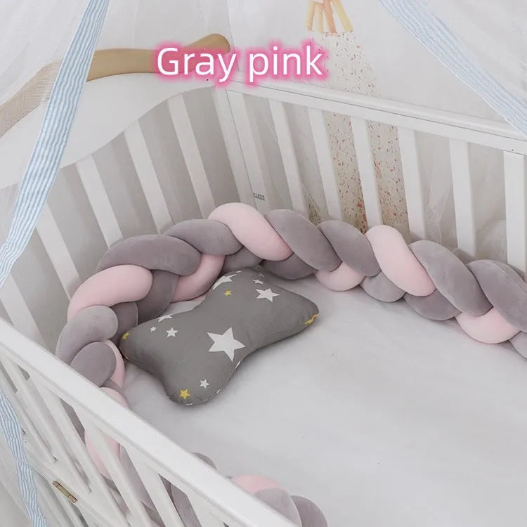 Multi-colour baby crib bumper made of spandex velvet, shown bent around a crib edge.