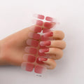 Full sheet of nail art stickers showing sixteen small designs including cross, rose, tulip, and leopard print patterns.
