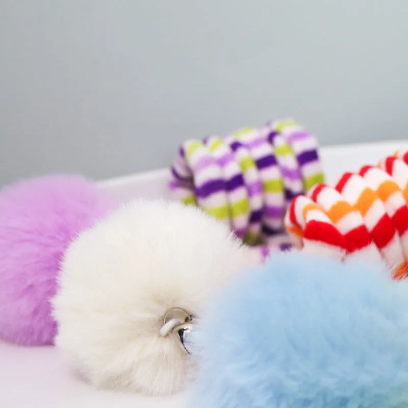 Hanging cat toy with suction cup, spring-mounted bell stick, and inflatable ball in multiple colour options
