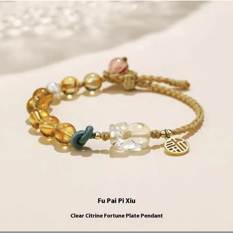 Hand-woven citrine crystal bracelet with zodiac animal design on wrist