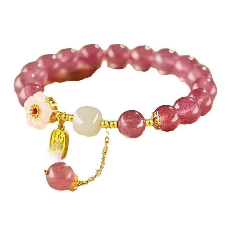 Hetian jade and strawberry quartz crystal bracelet for women showing manual craftsmanship and natural stone variations