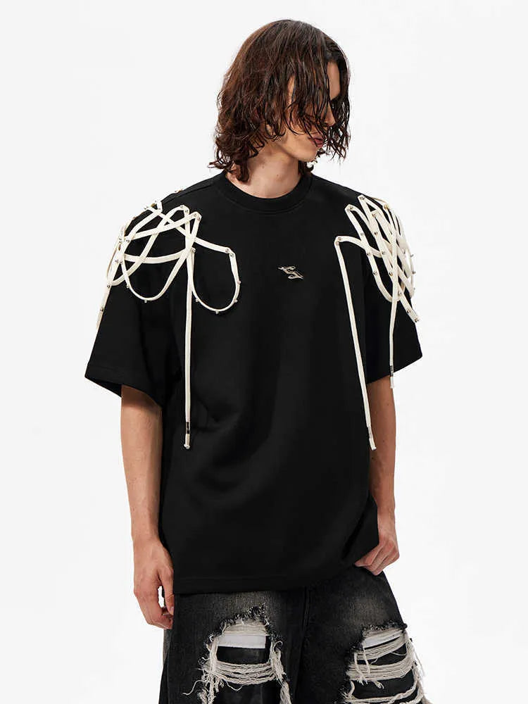 Black loose fit T-shirt with padded shoulders featuring rivet ribbon decoration and short sleeves