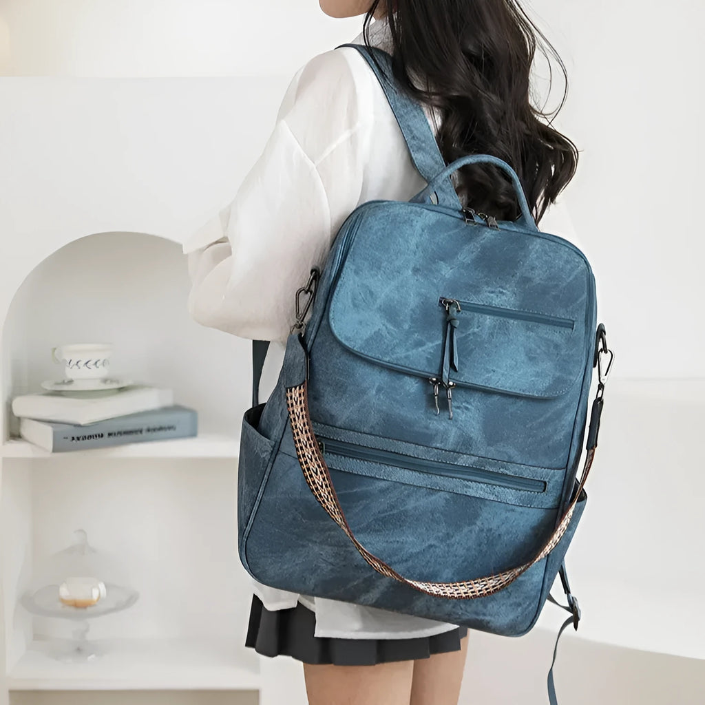 Retro college student backpack in solid colour with curved shoulder straps and stitching detail