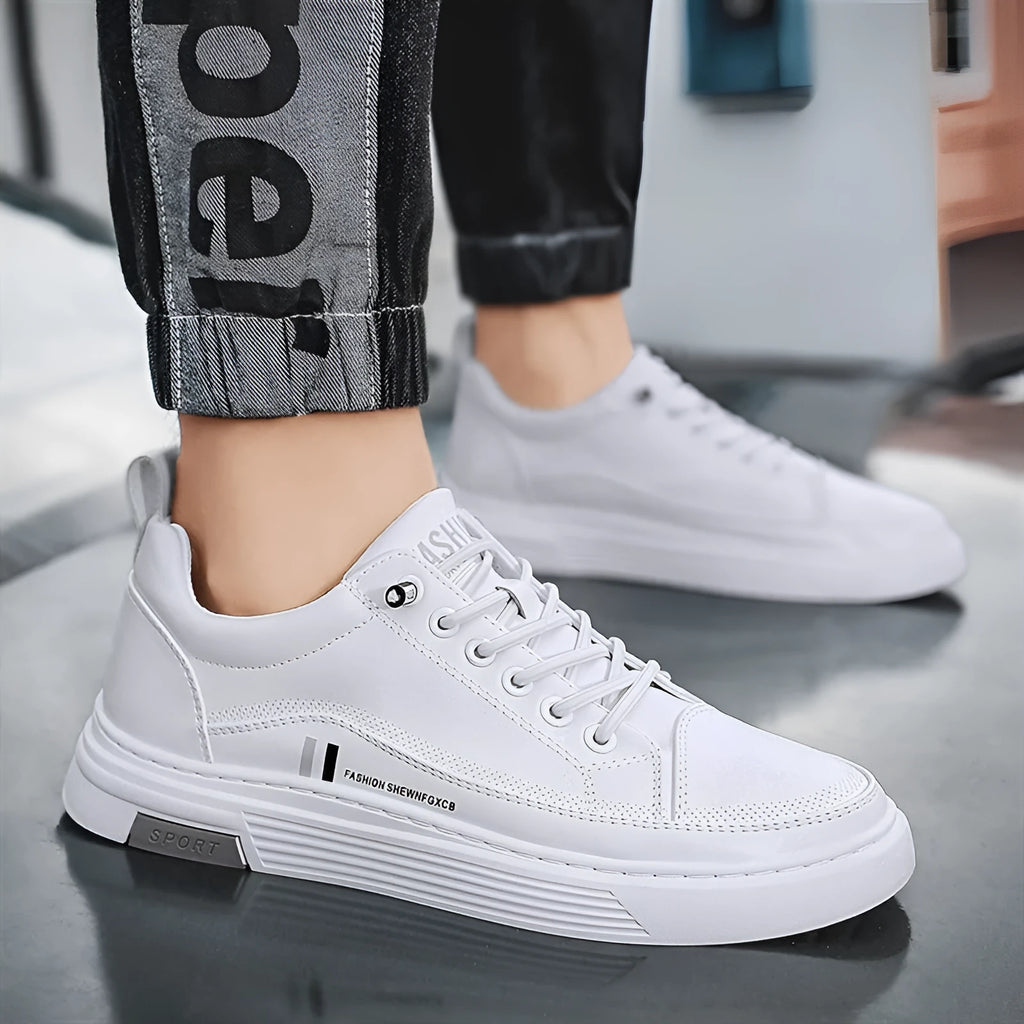 Men's white low-top skate shoes with elastic band and round toe, on a plain background.