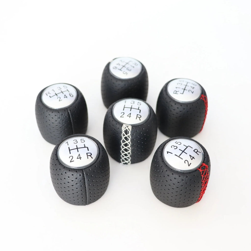Sewn wrapped perforated PU leather handball gear for Alpha vehicles in black, red, or white.