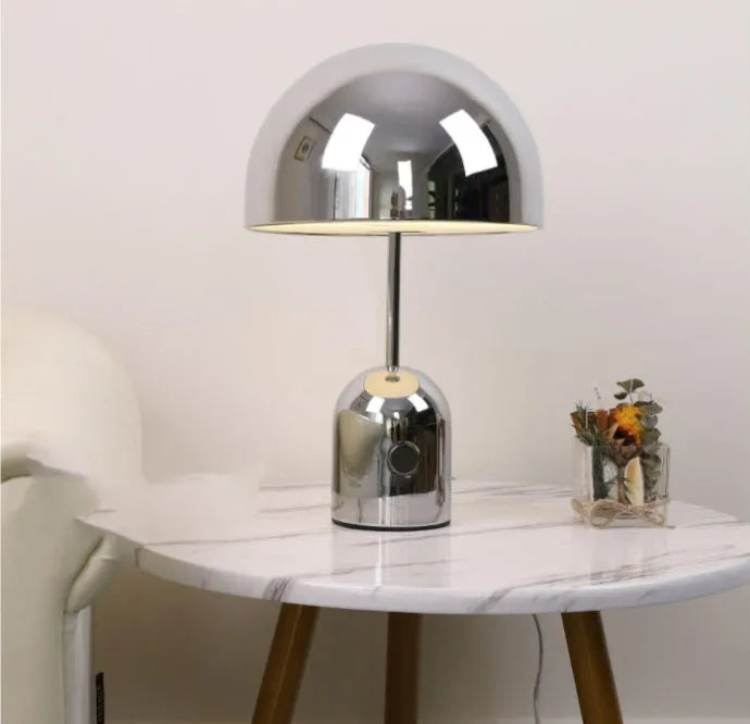 Mushroom-shaped table lamp with a metal base in rose gold finish
