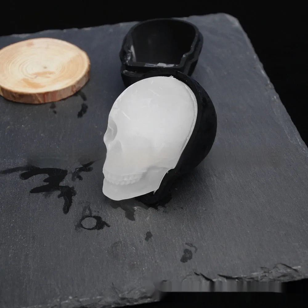 Silicone Halloween ice tray making 3D skull-shaped ice cubes.