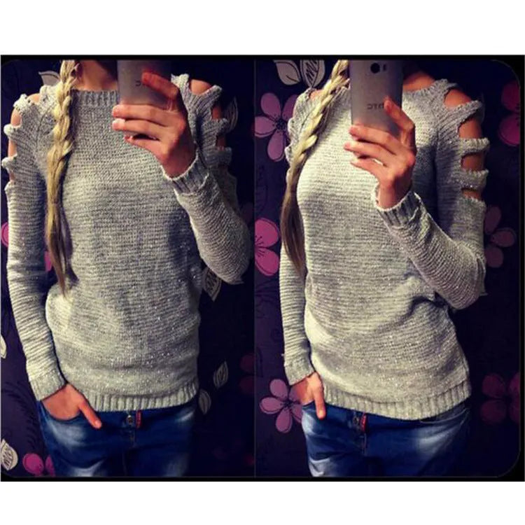 Women's grey knitted pullover shirt with crocheted hollow-out patterns on the sleeves and body.