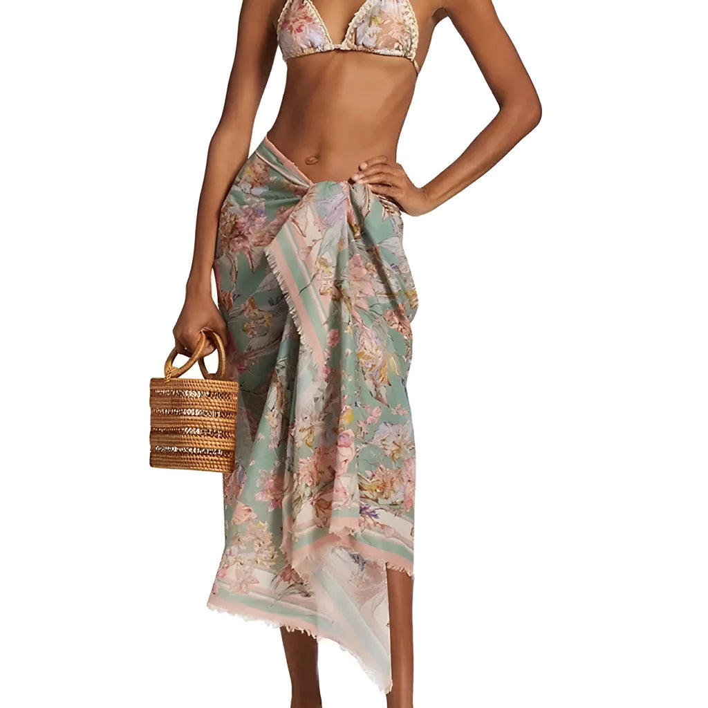 Women's floral bikini swimsuit set with skirt in creamy-white colour, showing top, briefs, and cover-up components