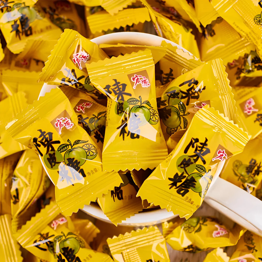 Three bags of hard candy: plum sugar, guava, and tangerine peel flavours.