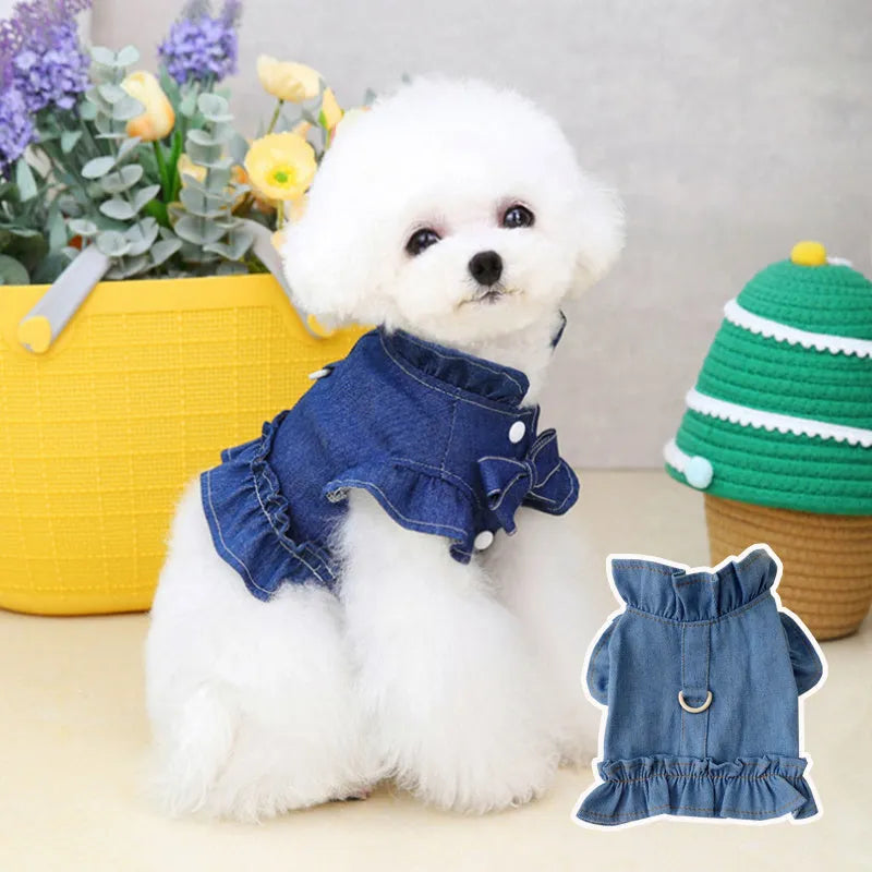 Blue denim dress for a dog or cat with ruffles and a metal leash hook on the chest.