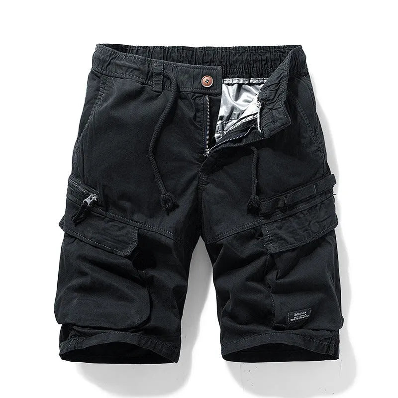 Men's army green cotton shorts with a zipper fly and multiple pockets, laid flat.