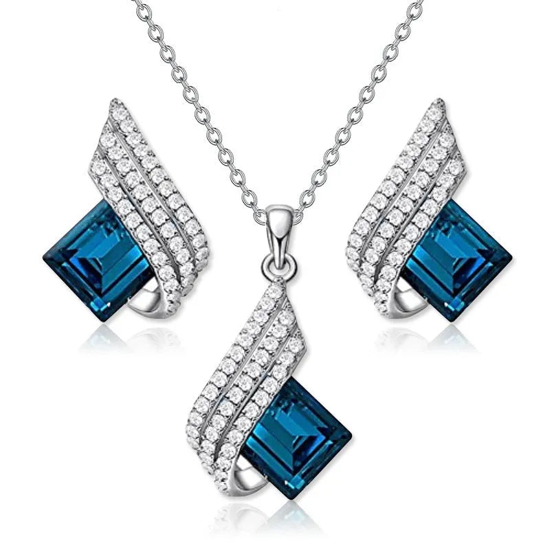 Glass and alloy necklace and earring set with cross chain styling and electroplated ornament details
