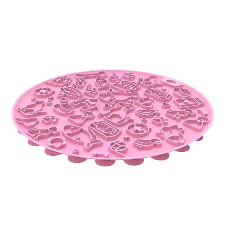 Round grey silicone pet lick mat with textured surface and a clear suction cup on its base.