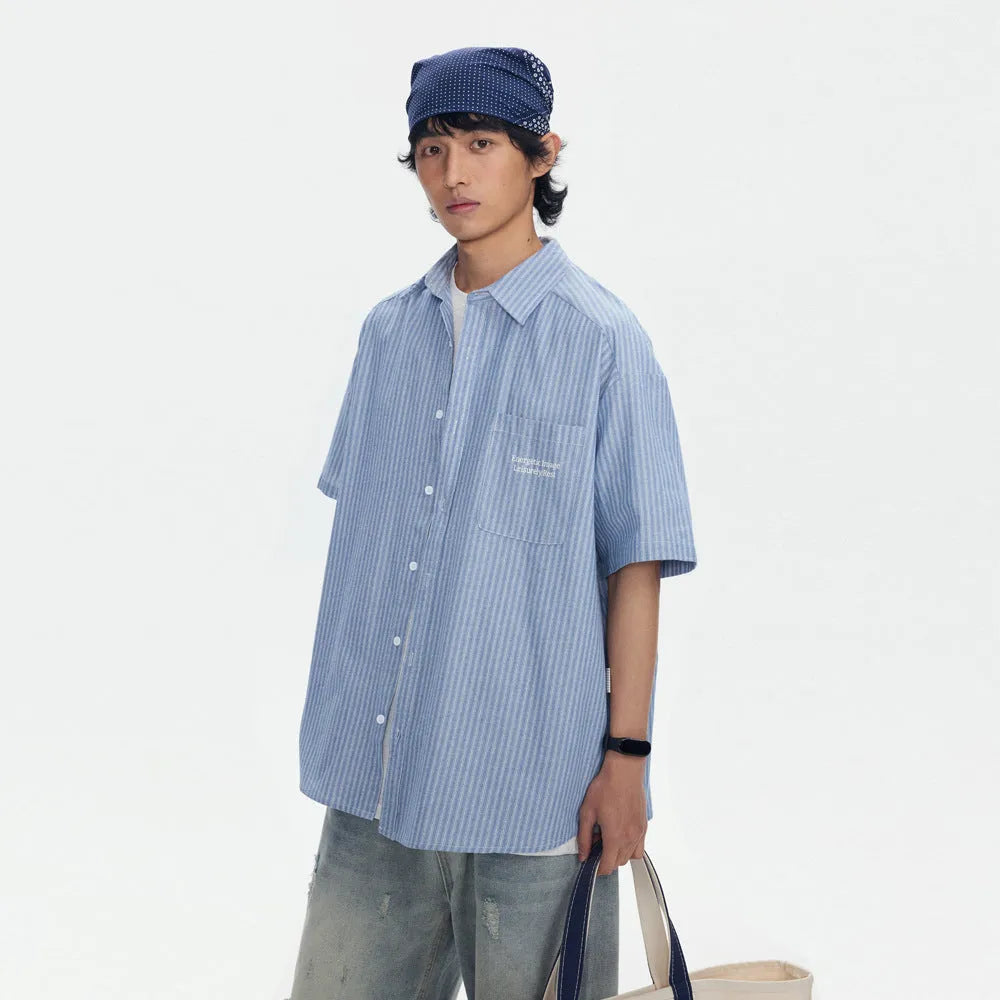 Blue striped unisex short-sleeve overall shirt in a loose cardigan style