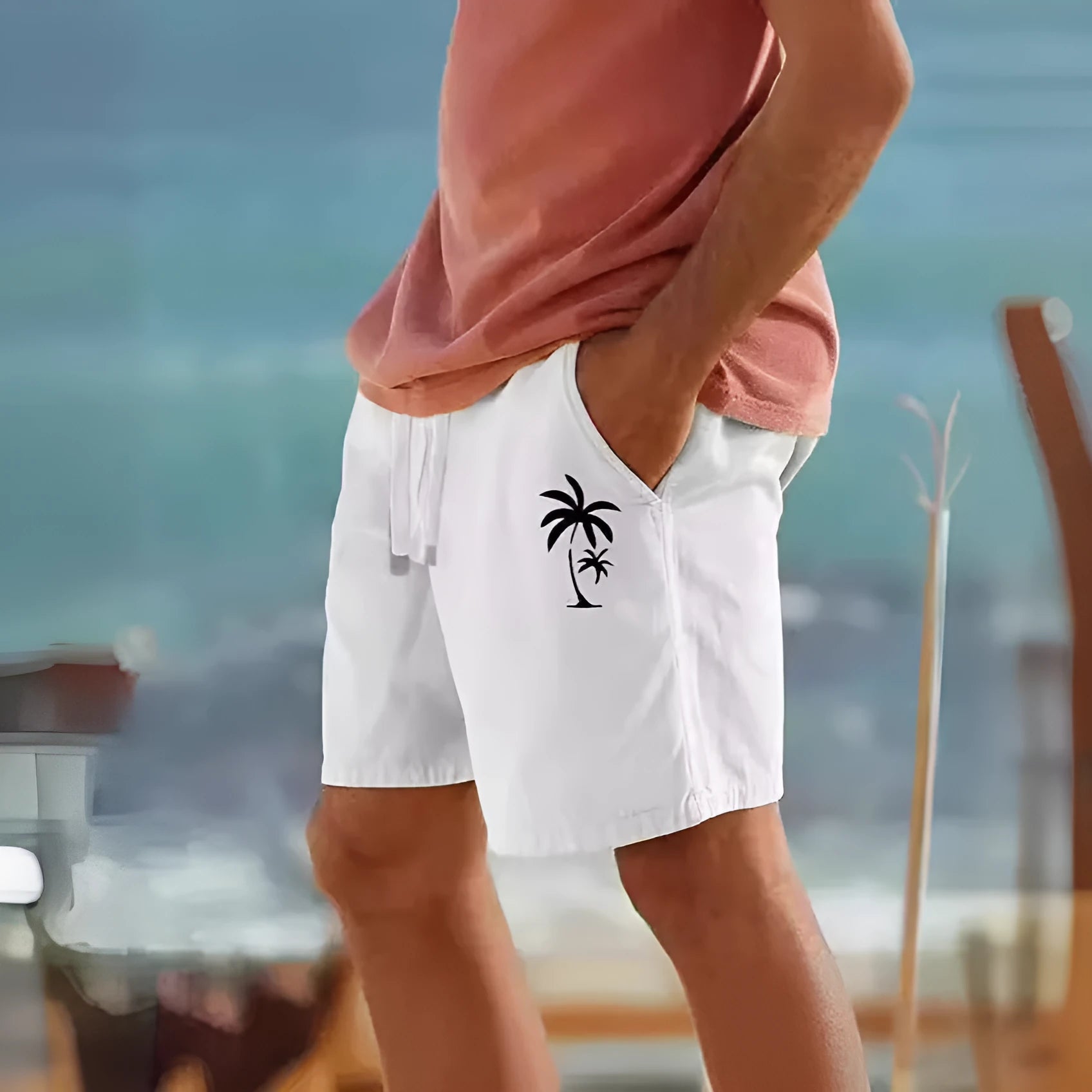 Men's beige cotton blend drawstring shorts with a floral heat transfer patch on the leg
