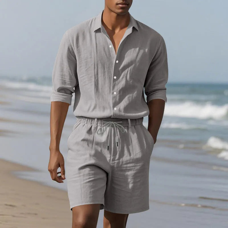 Linen long sleeve shirt and matching shorts beach set in light blue, laid flat.