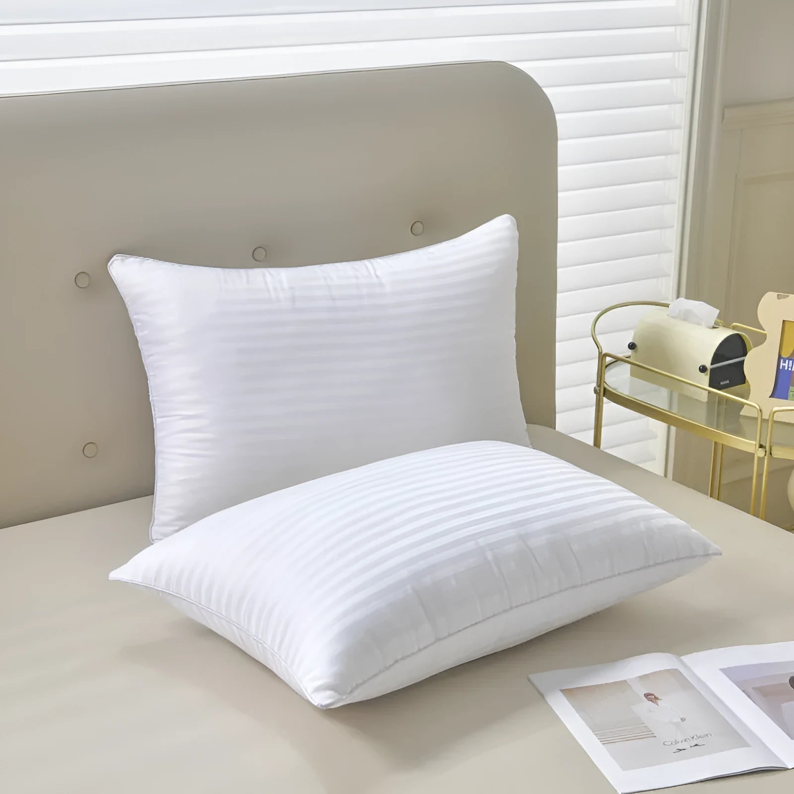 White cotton satin stripe feather pillow showing natural filling and simple styling