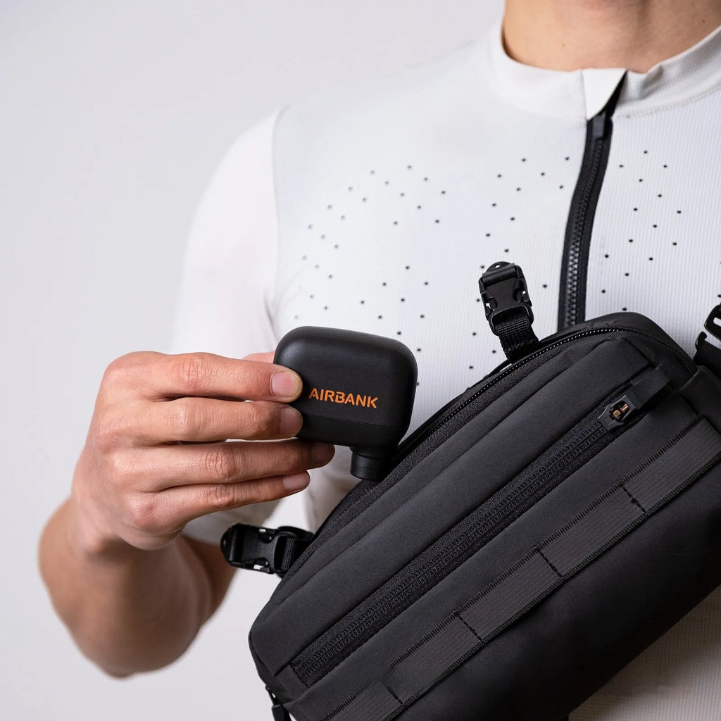 Black AS100 electric bicycle pump with USB charging cable and waterproof storage bag