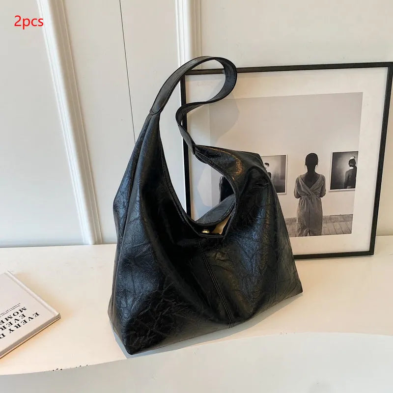 Soft PU leather shoulder bag with sewing thread accents and sandwich pocket design