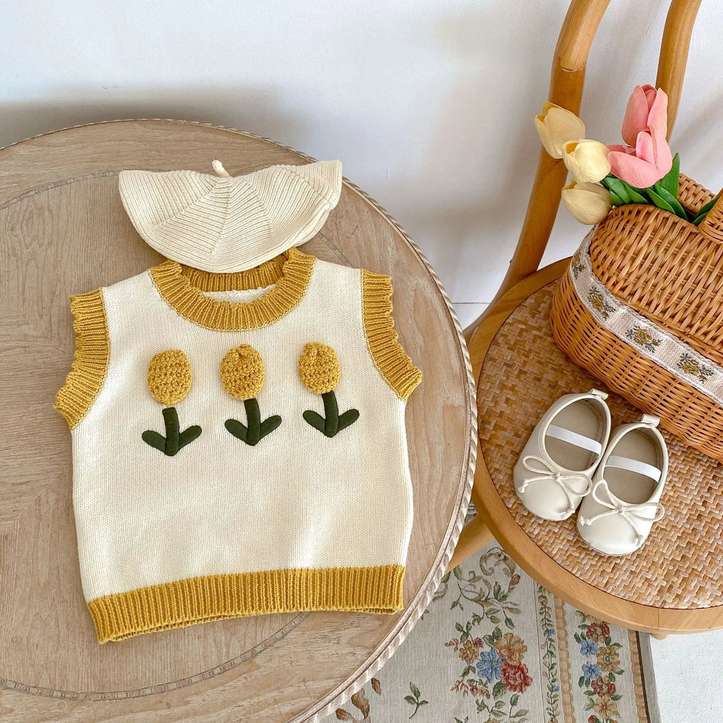 Baby girl sleeveless knitted cotton top with three-dimensional flower in almond white