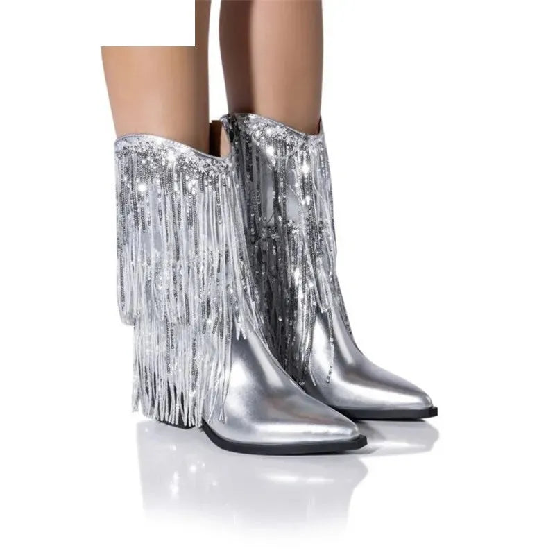 Women's black chunky heel tassel boots with a super high stiletto heel and pointed toe.