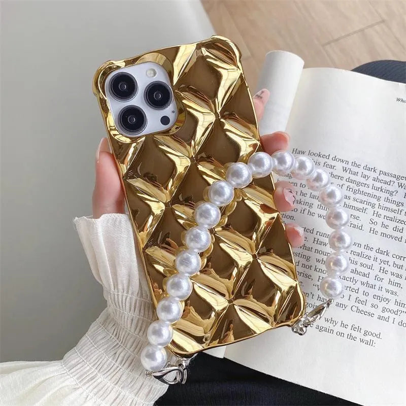 Luxury diamond bracelet design iPhone case in gold and silver colours with chain detail.