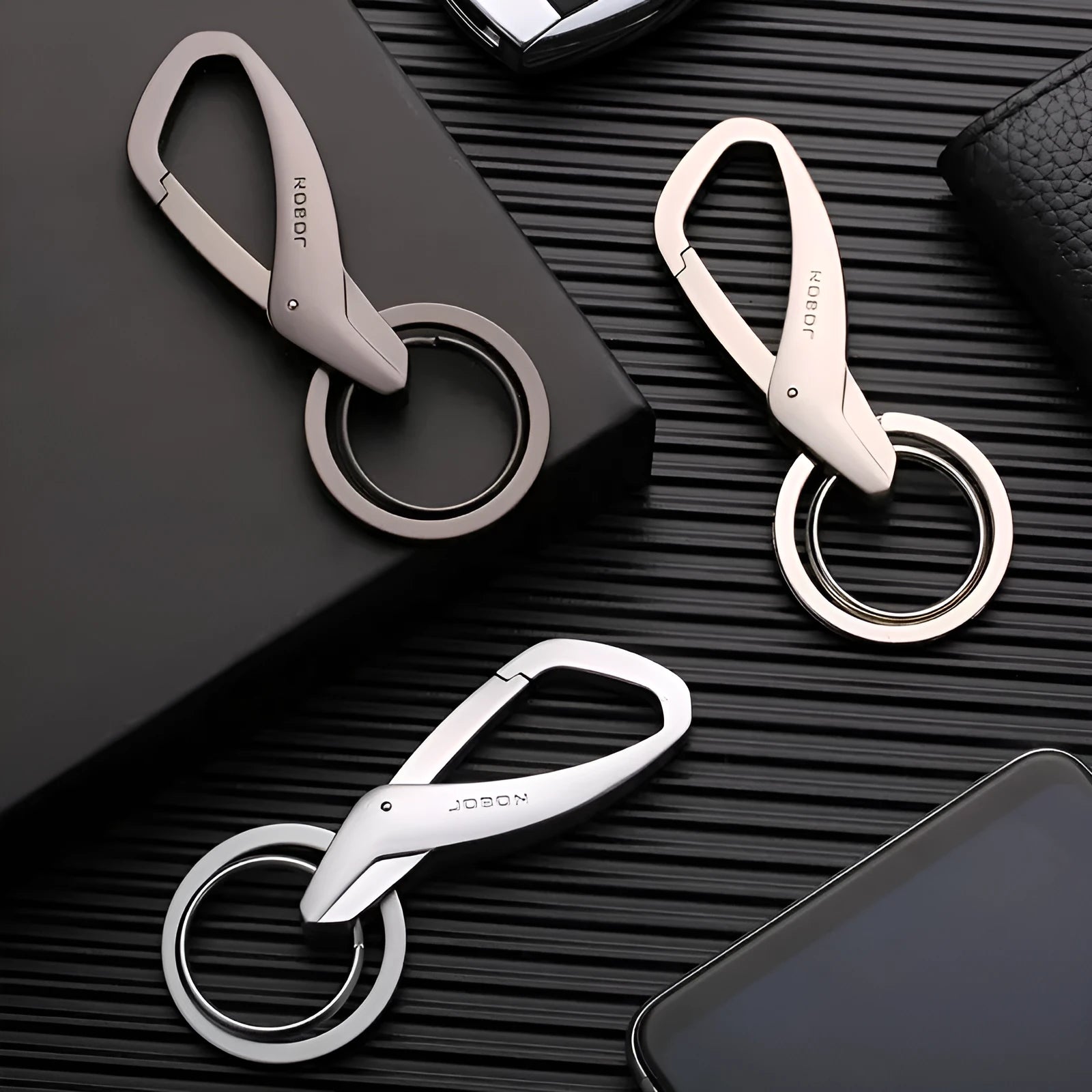 Zinc alloy double ring key waist hanger in black, chrome, and nickel colour options.