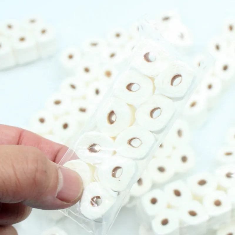Miniature paper model of a tissue roll toy for children, dimensions 30mm by 15mm by 80mm.
