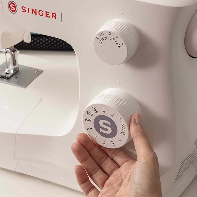 M2405 portable sewing machine with accessories on tabletop
